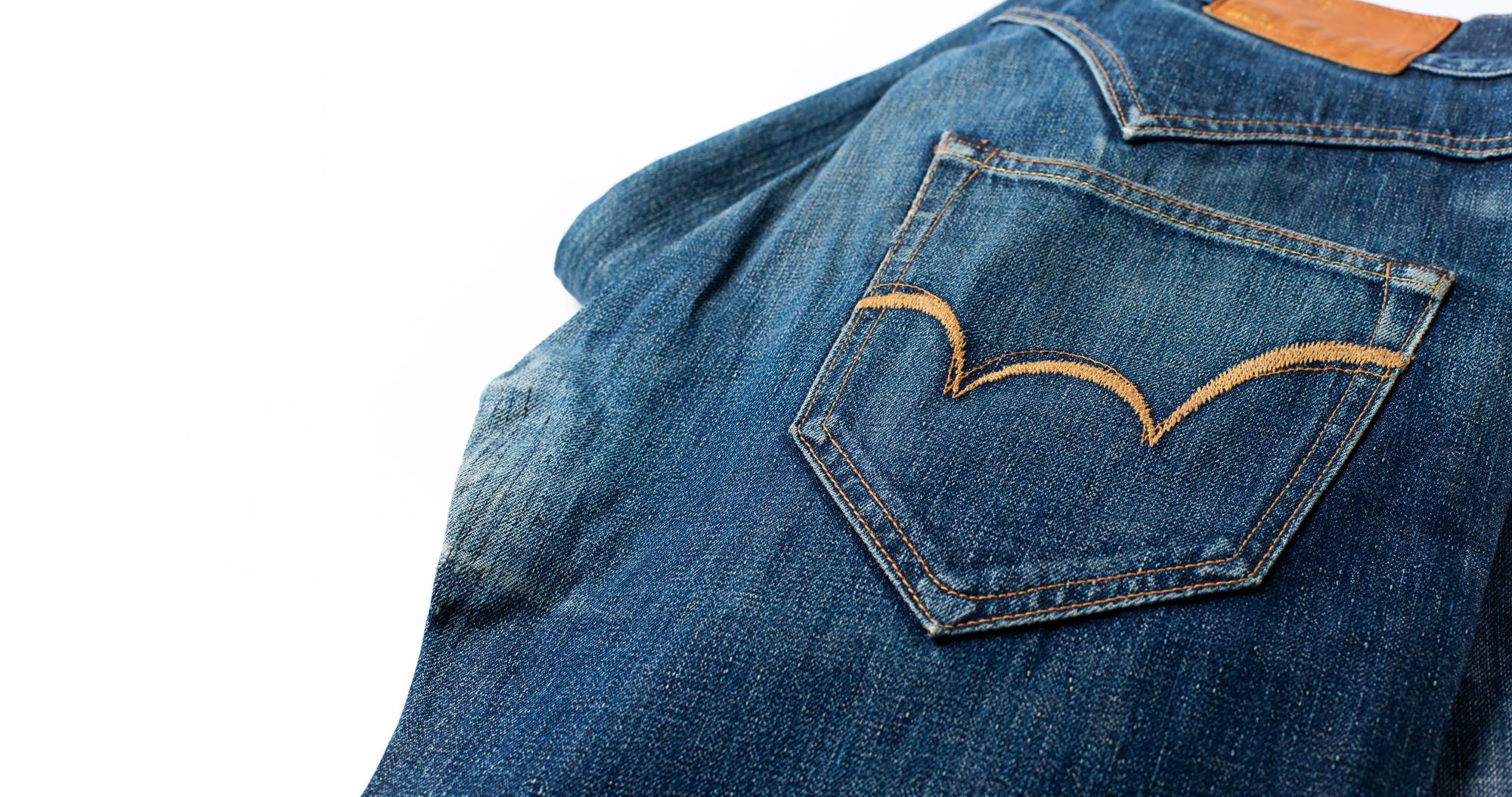 Branded patches on denim jacket